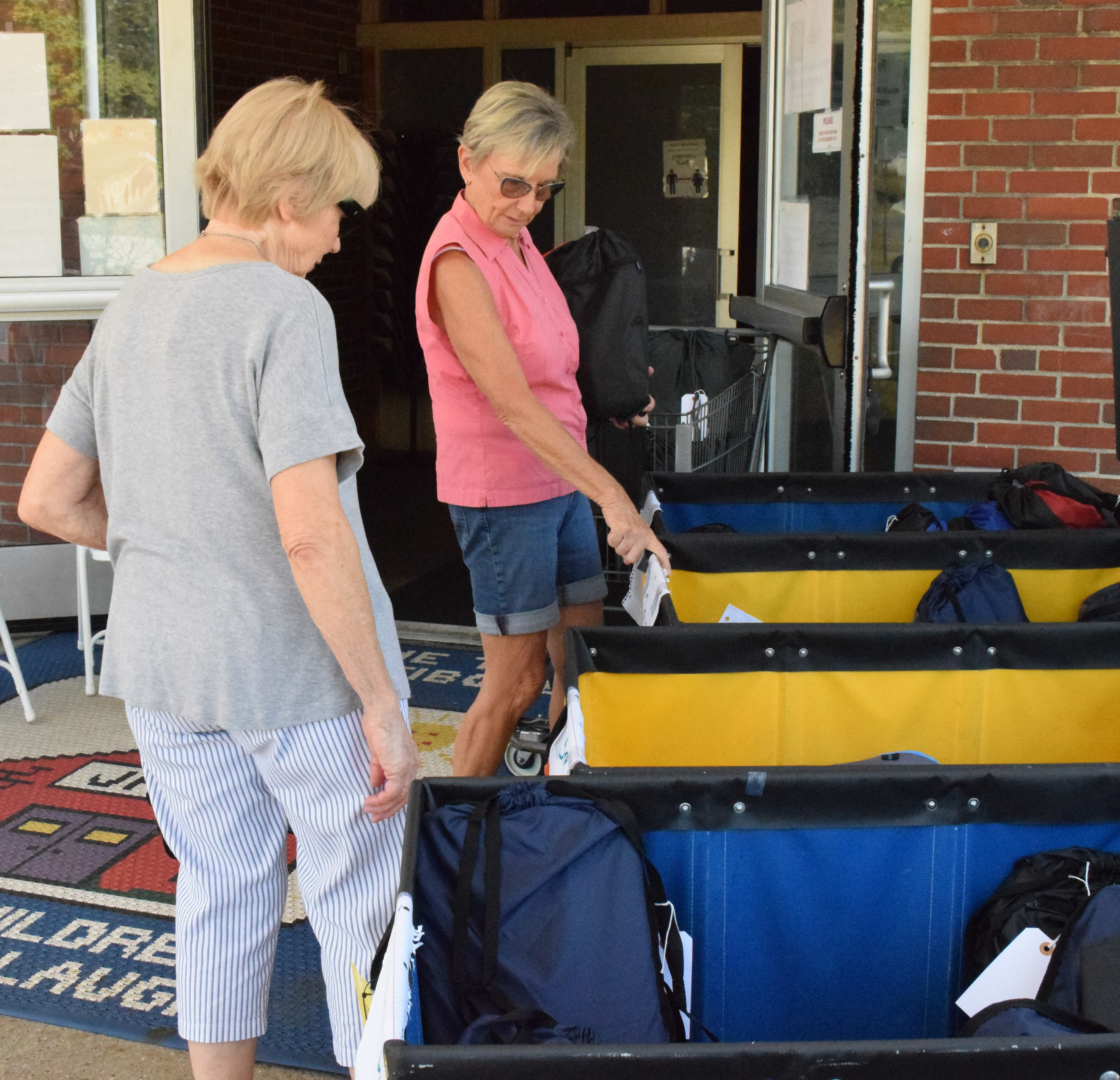 Students in Danbury pose at our annual Back-to-School Drive where they picked out backpacks of their choice filled with school supplies.